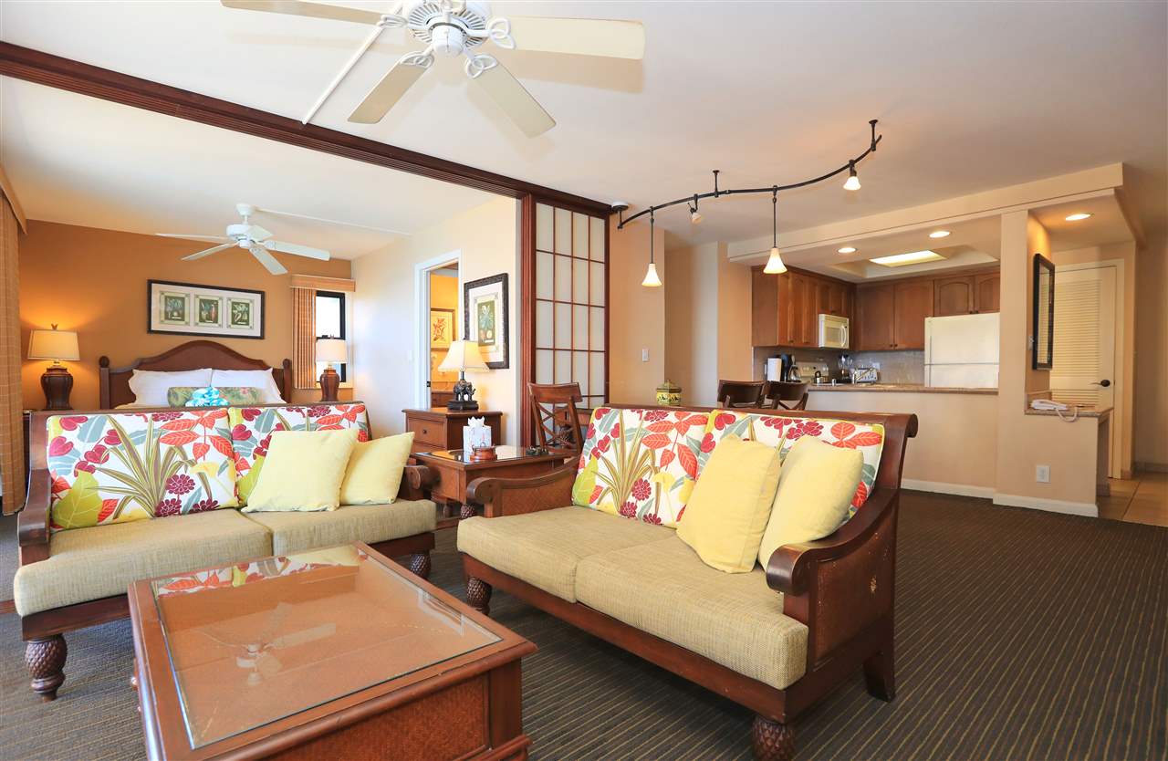 4401 Lower Honoapiilani Road, Unit B501 Lahaina, HI 96761 - Photo 4 of 14 a living room with furniture and a flat screen tv