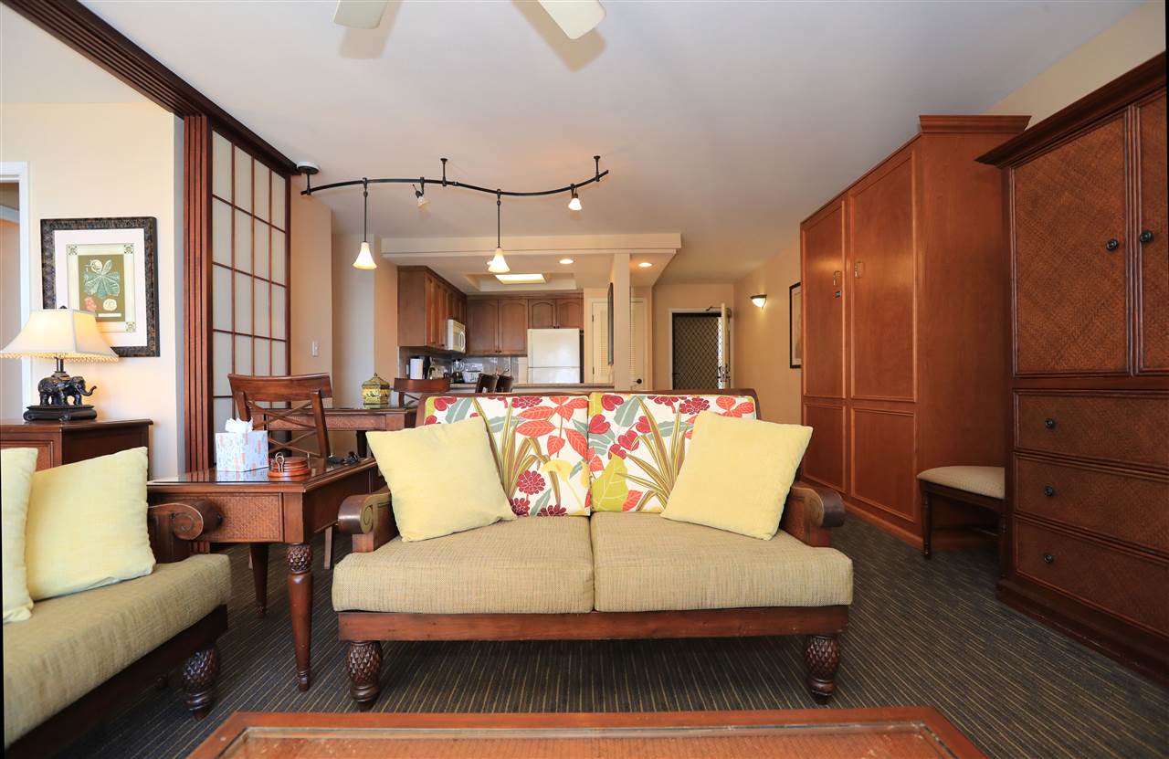 4401 Lower Honoapiilani Road, Unit B501 Lahaina, HI 96761 - Photo 5 of 14 a living room with furniture kitchen view and a wooden floor