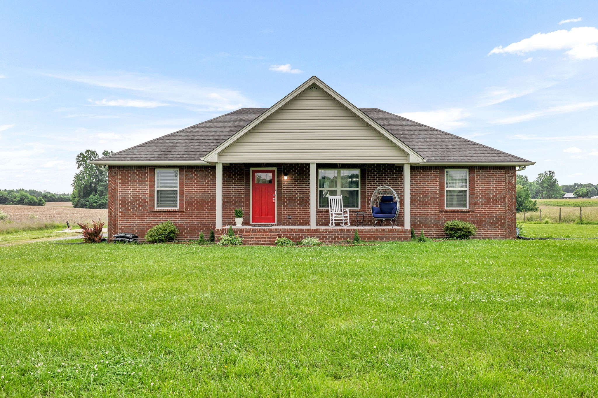 2164 Akersville Road Lafayette, TN 37083 - Photo 1 of 32 a view of a house with a backyard and porch