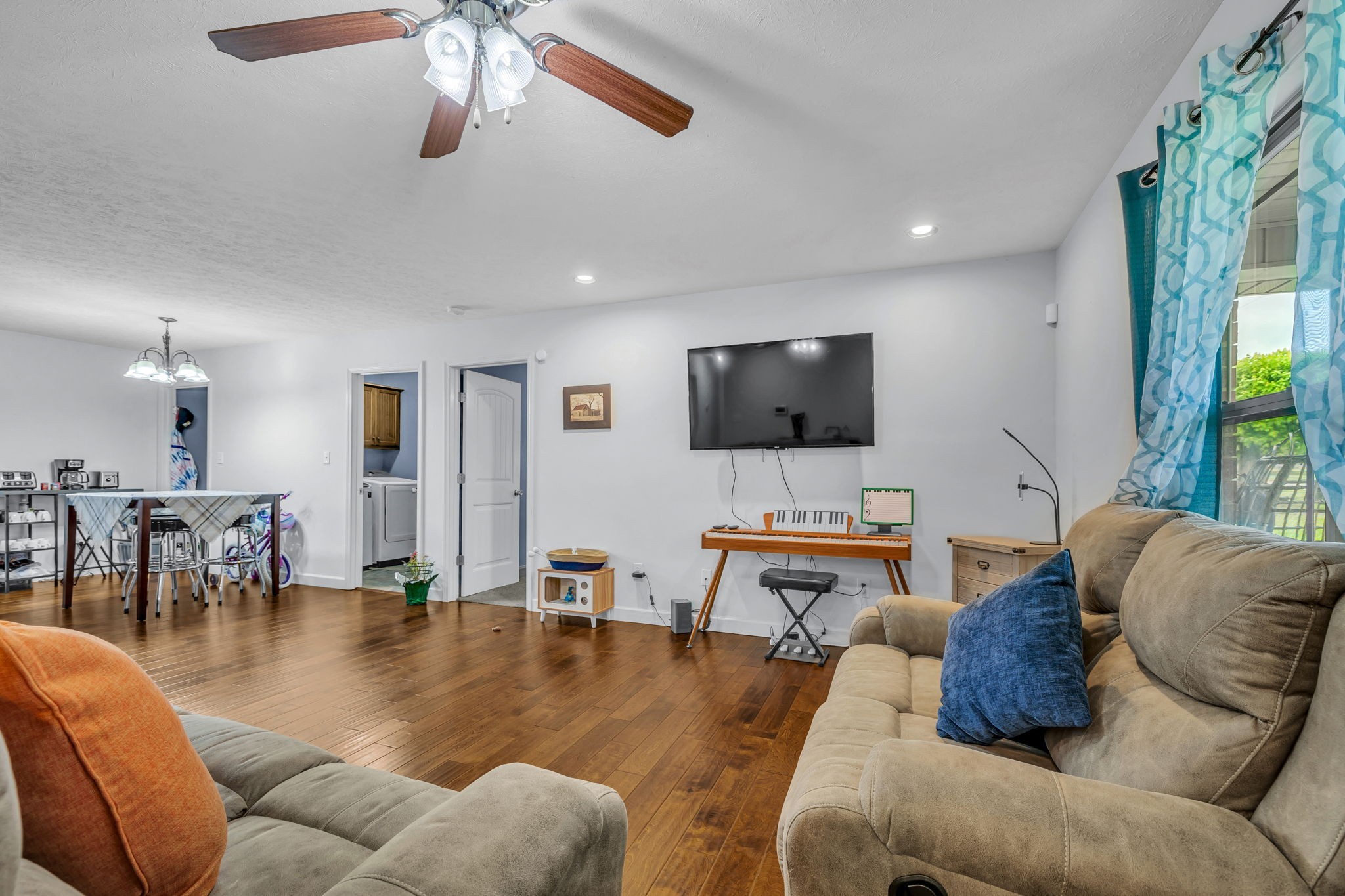 2164 Akersville Road Lafayette, TN 37083 - Photo 13 of 32 a living room with furniture and a flat screen tv