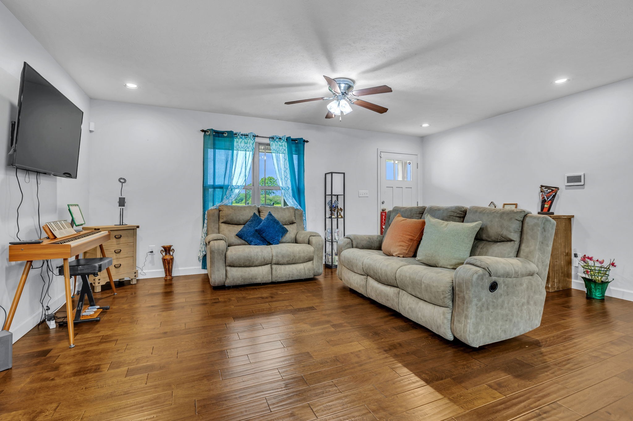 2164 Akersville Road Lafayette, TN 37083 - Photo 15 of 32 a living room with furniture and a flat screen tv