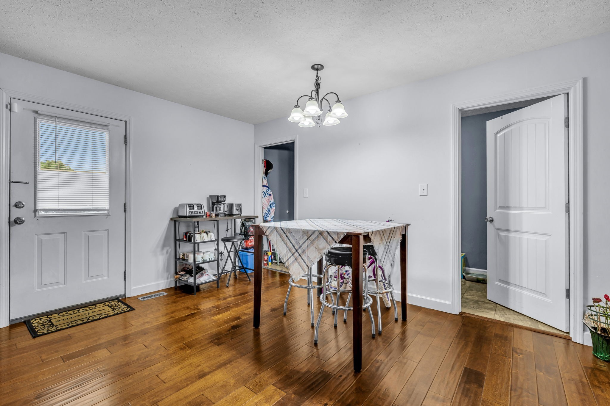 2164 Akersville Road Lafayette, TN 37083 - Photo 22 of 32 a view of a dining room with furniture and wooden floor