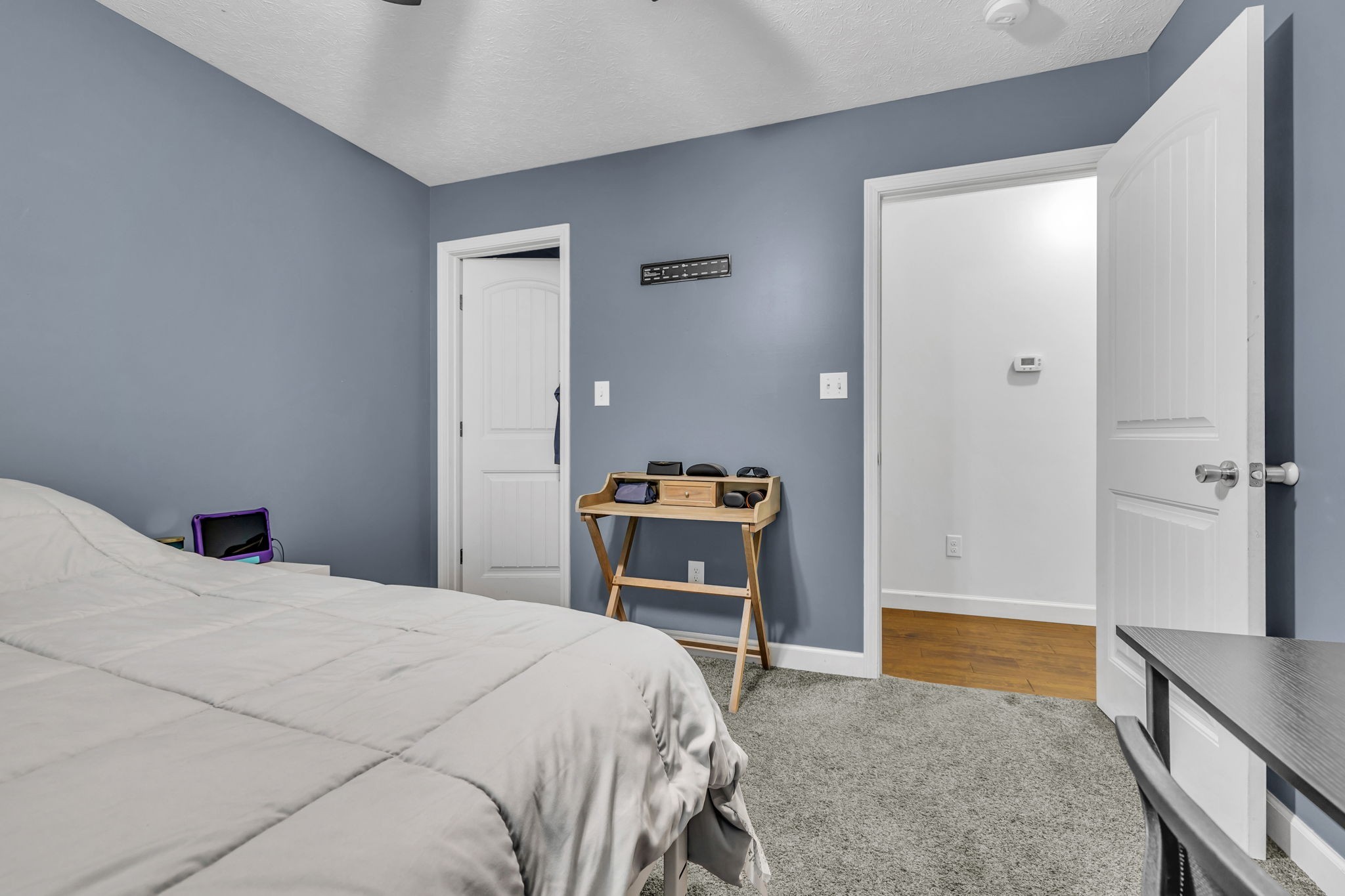 2164 Akersville Road Lafayette, TN 37083 - Photo 28 of 32 a bedroom with a bed and a sink