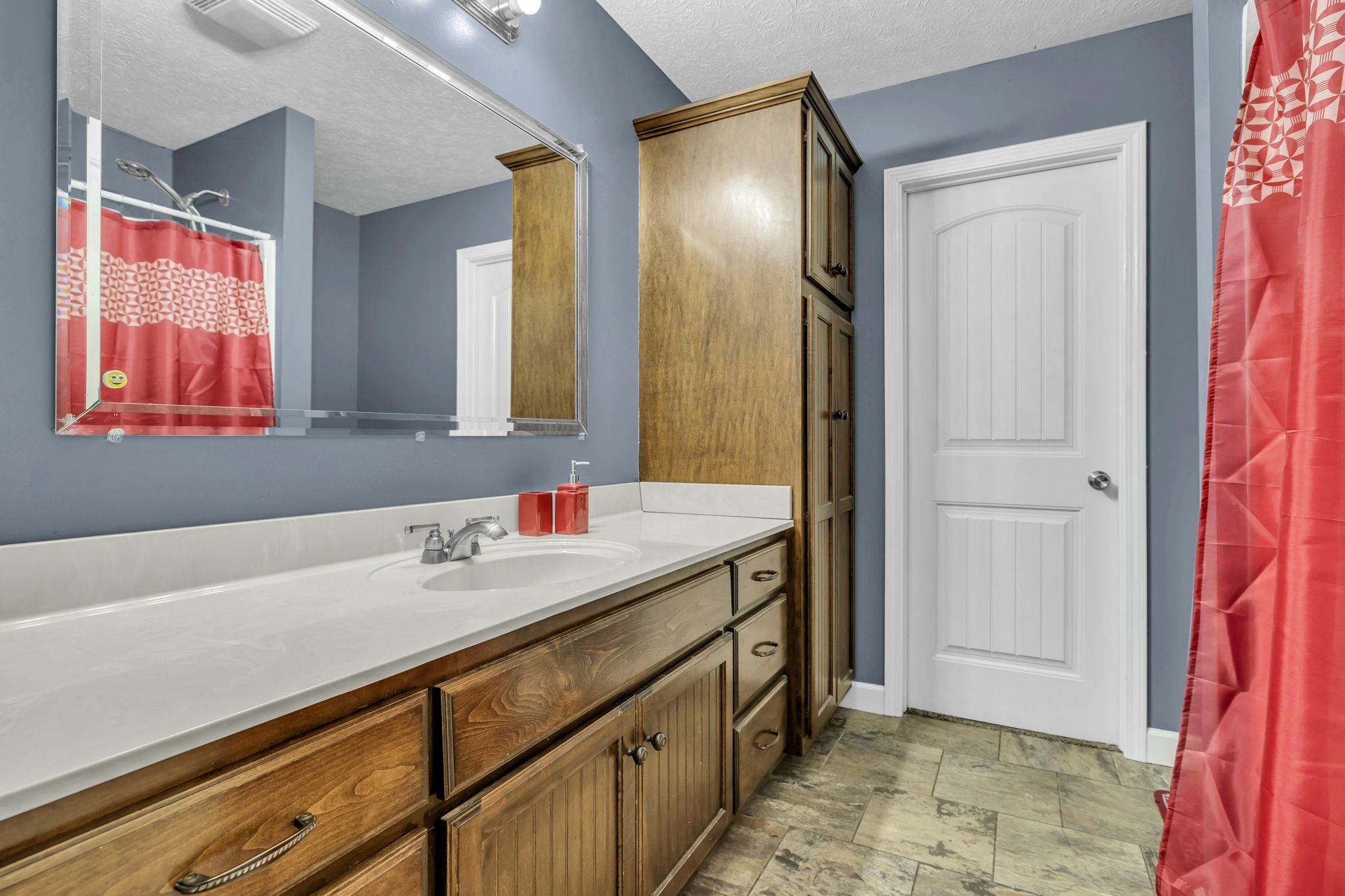 2164 Akersville Road Lafayette, TN 37083 - Photo 31 of 32 a bathroom with a sink and a mirror