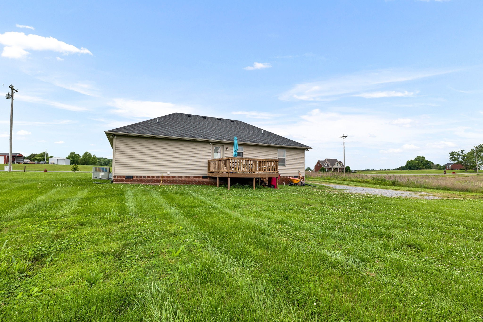 2164 Akersville Road Lafayette, TN 37083 - Photo 9 of 32 a backyard of a house with table and chairs