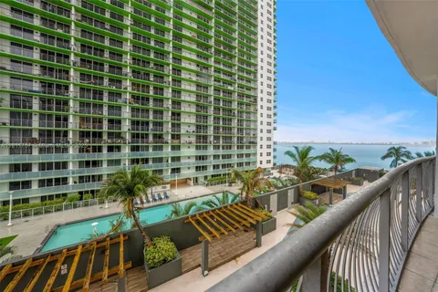 a view of balcony with wooden floor