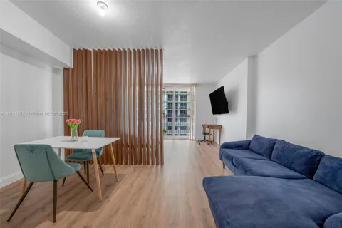 a bedroom with a bed and a desk