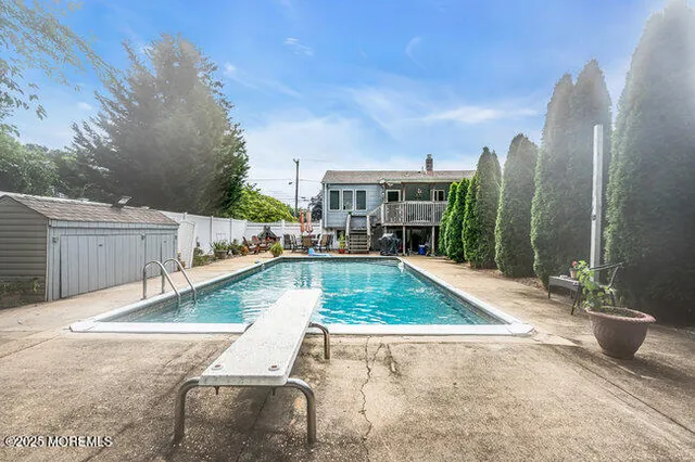a view of a swimming pool with a patio