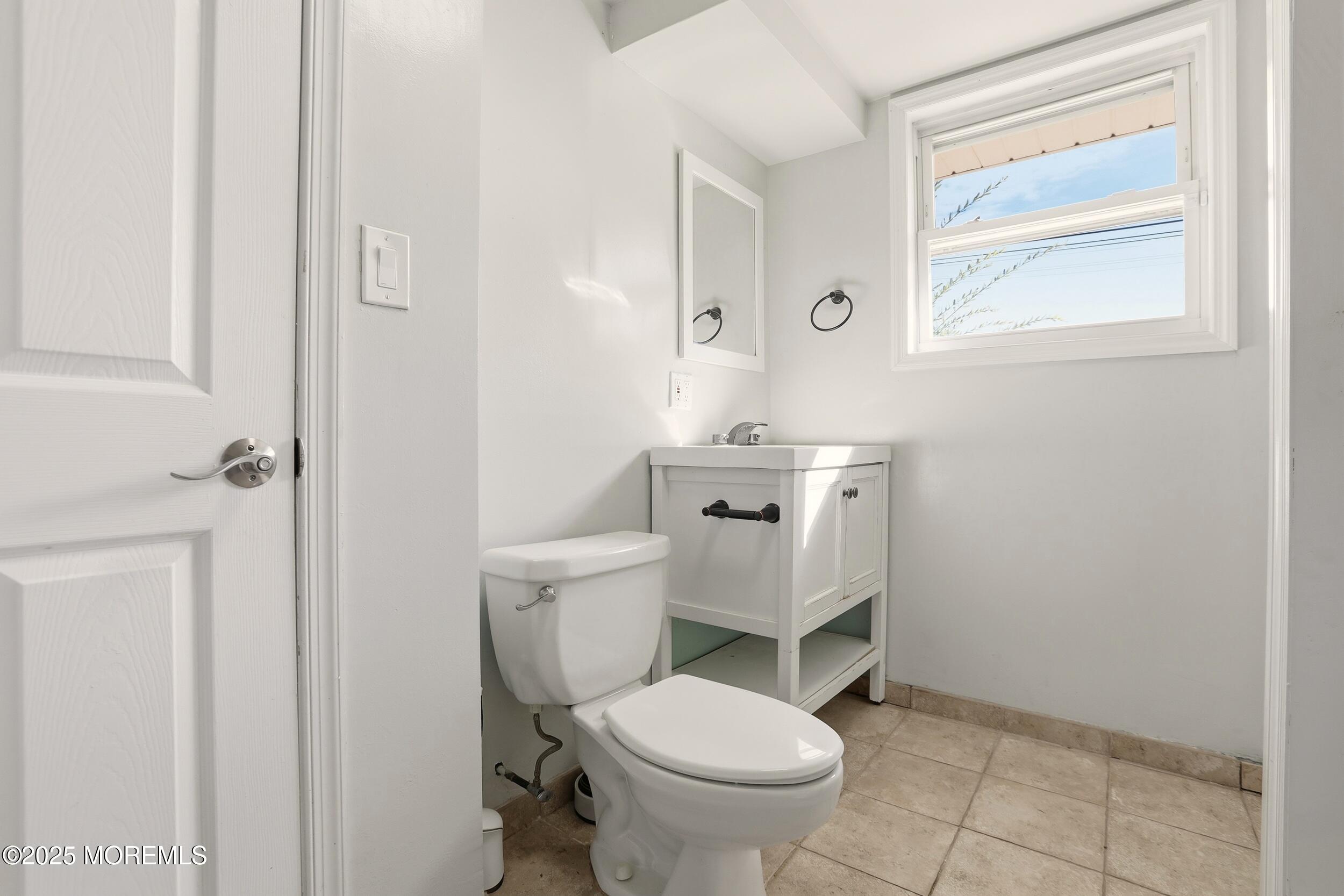 19 Kensington Drive Howell, NJ 07731 - Photo 12 of 31 a bathroom with a toilet sink and mirror