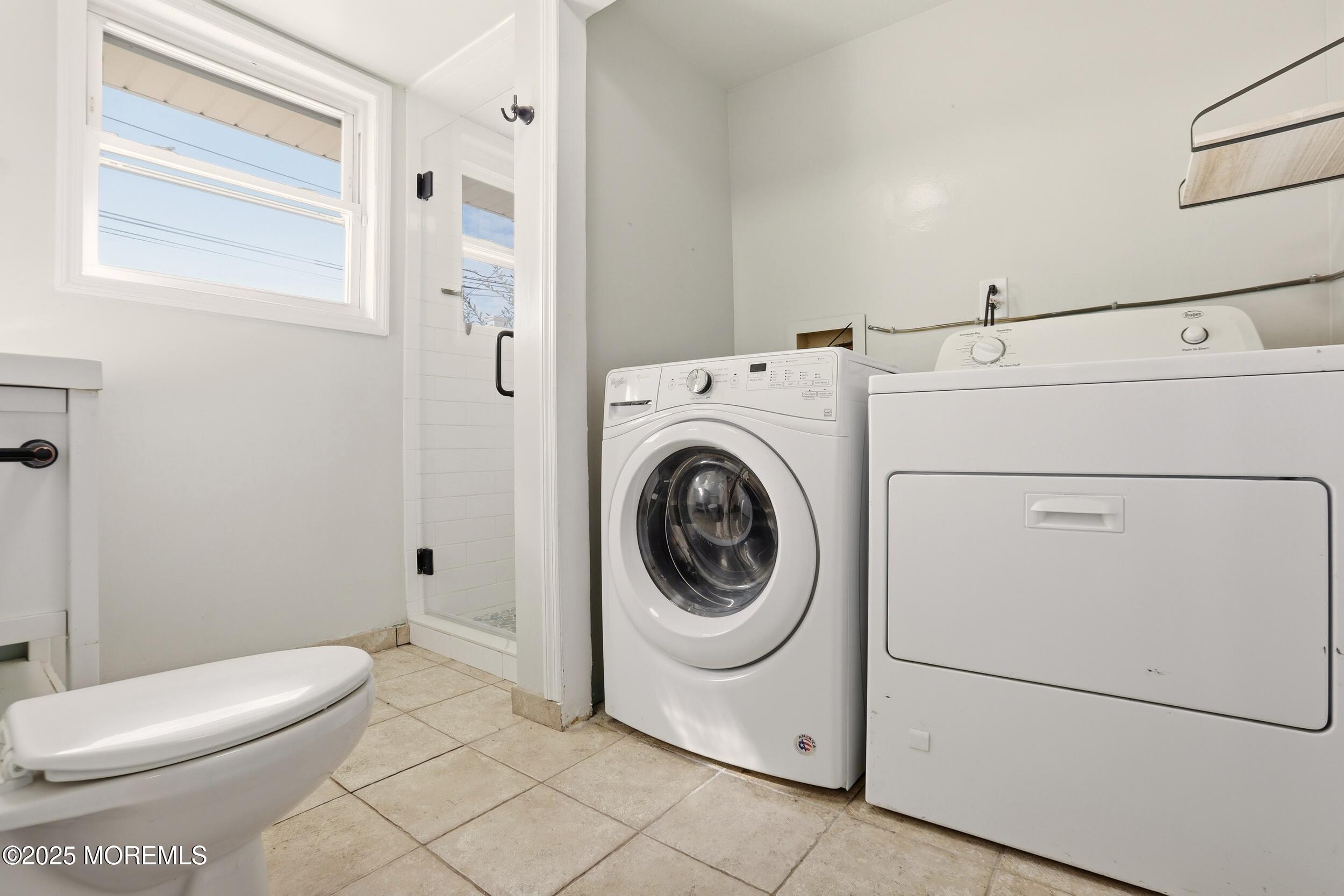 19 Kensington Drive Howell, NJ 07731 - Photo 13 of 31 a white toilet sitting next to a bathroom sink