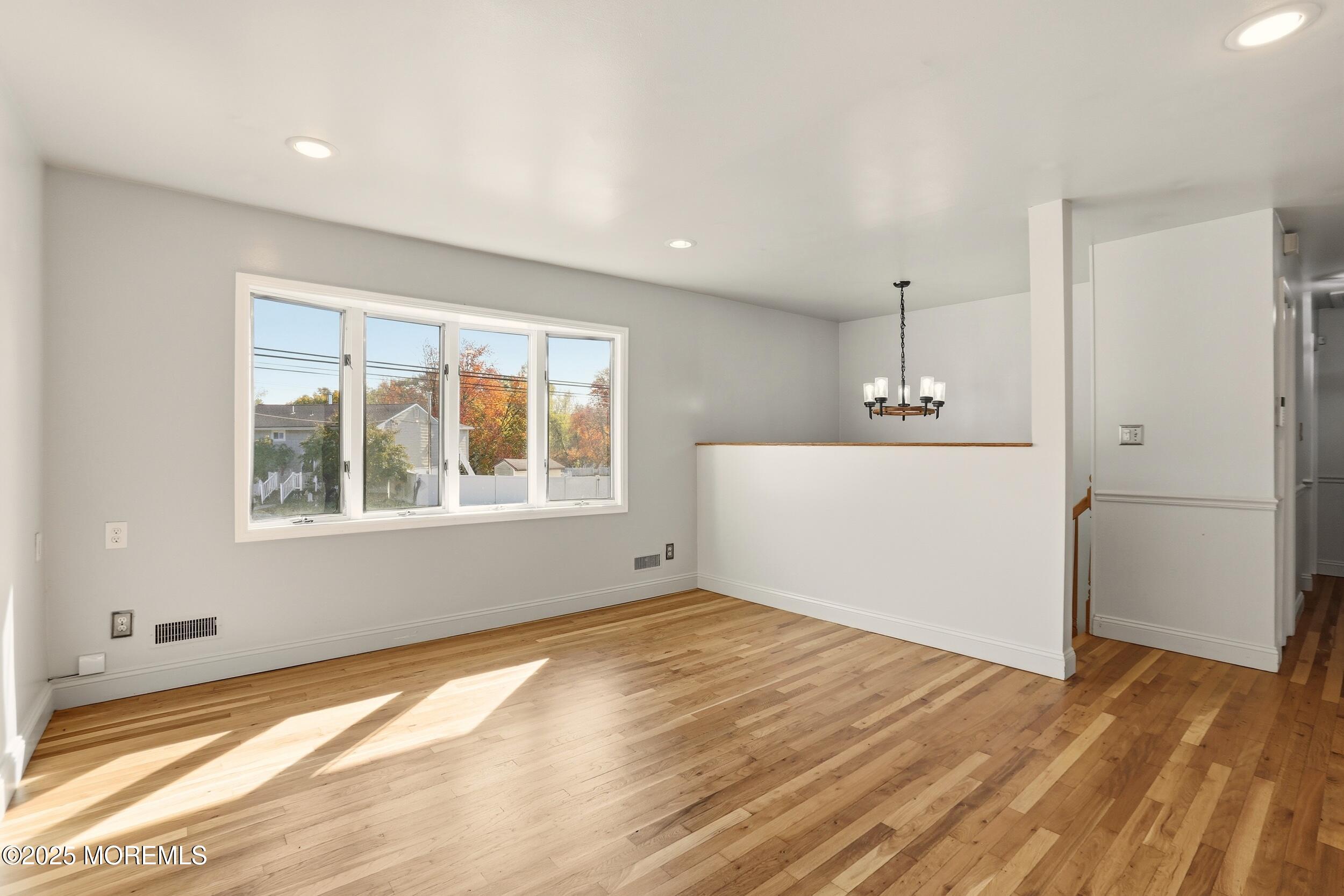 19 Kensington Drive Howell, NJ 07731 - Photo 17 of 31 a view of empty room with wooden floor and fan