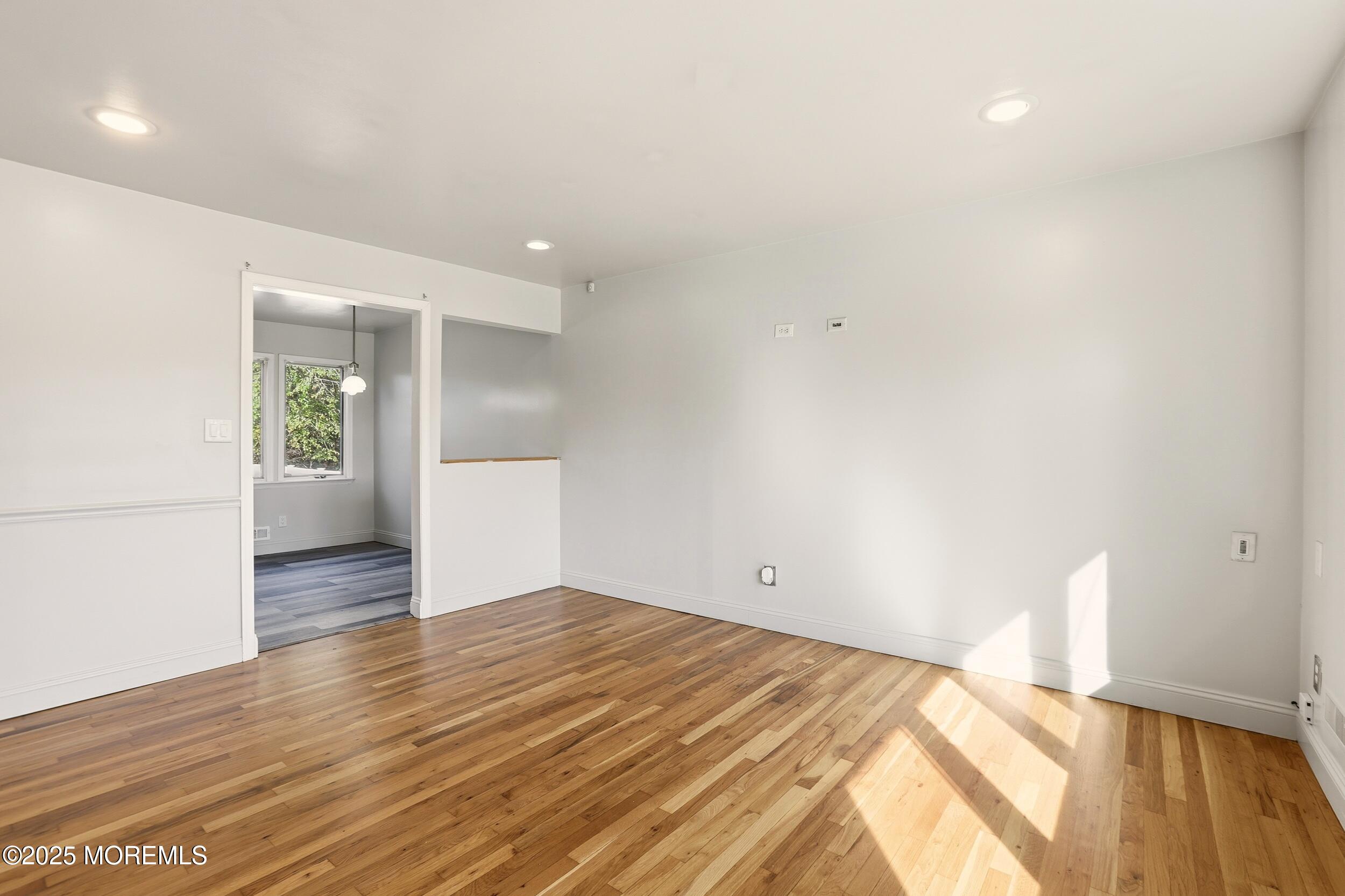 19 Kensington Drive Howell, NJ 07731 - Photo 18 of 31 a view of empty room with wooden floor
