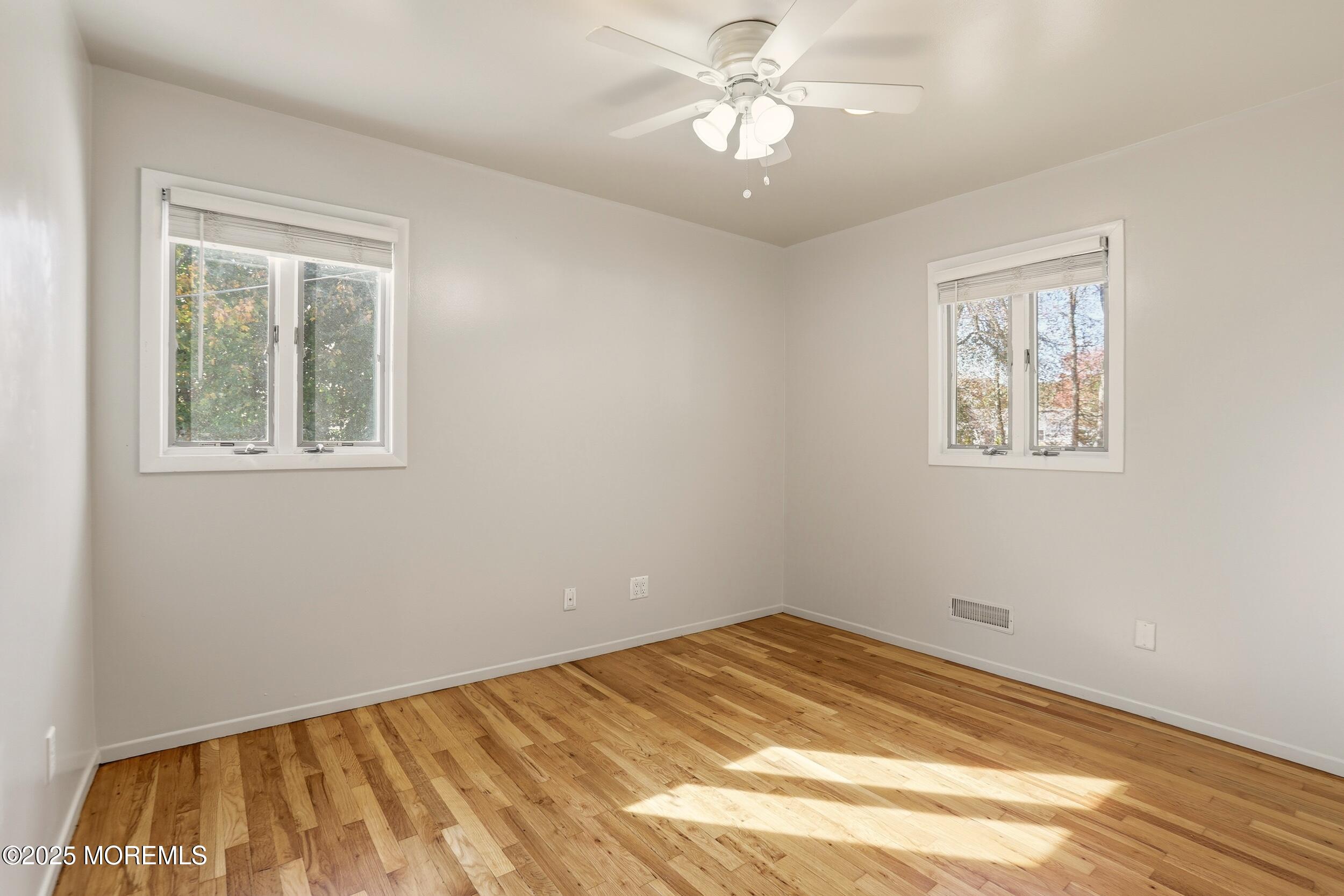 19 Kensington Drive Howell, NJ 07731 - Photo 21 of 31 a view of empty room with wooden floor