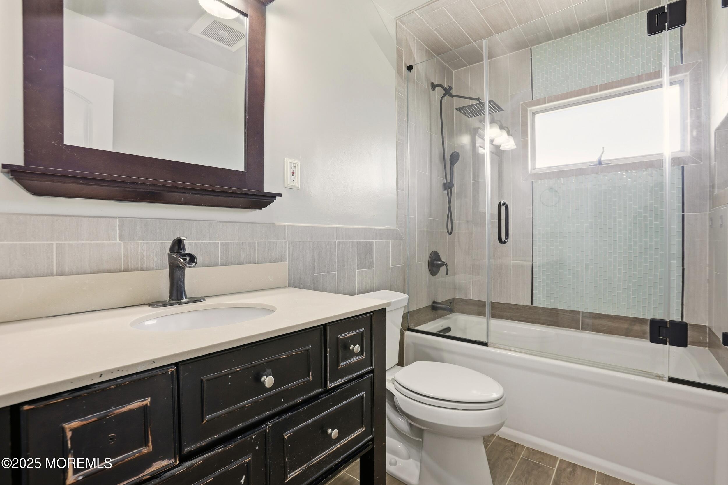 19 Kensington Drive Howell, NJ 07731 - Photo 25 of 31 a bathroom with a sink a toilet and shower