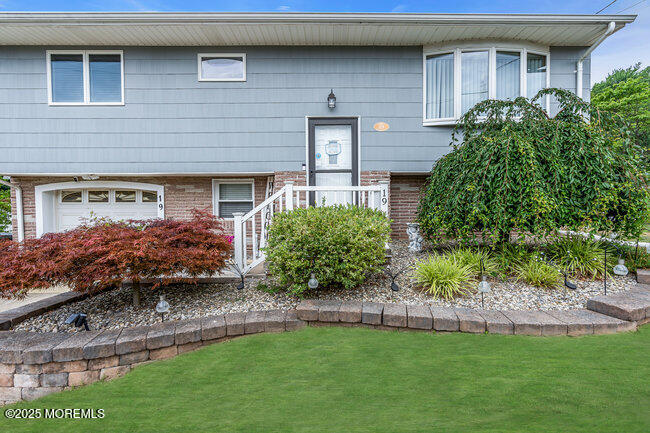 19 Kensington Drive Howell, NJ 07731 - Photo 3 of 31 a front view of a house with a garden