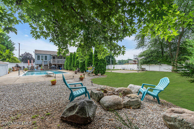 19 Kensington Drive Howell, NJ 07731 - Photo 5 of 31 a view of a swimming pool and lounge chair
