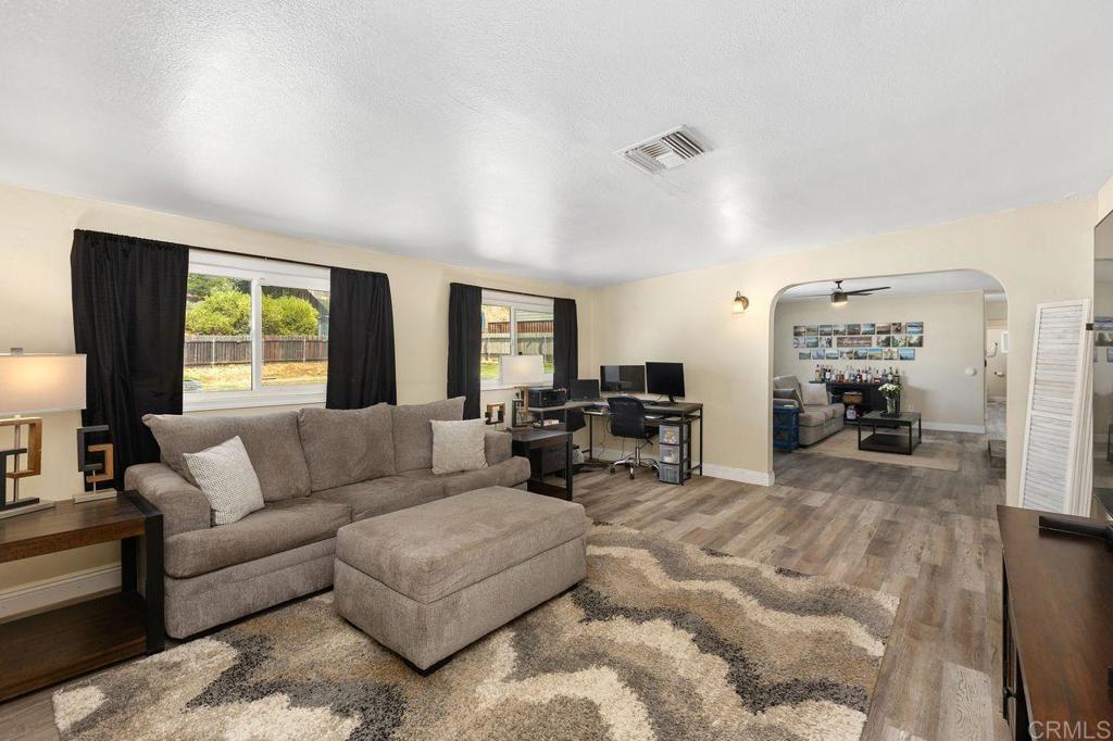 8229 Medill Avenue El Cajon, CA 92021 - Photo 12 of 34 a living room with furniture and a large window
