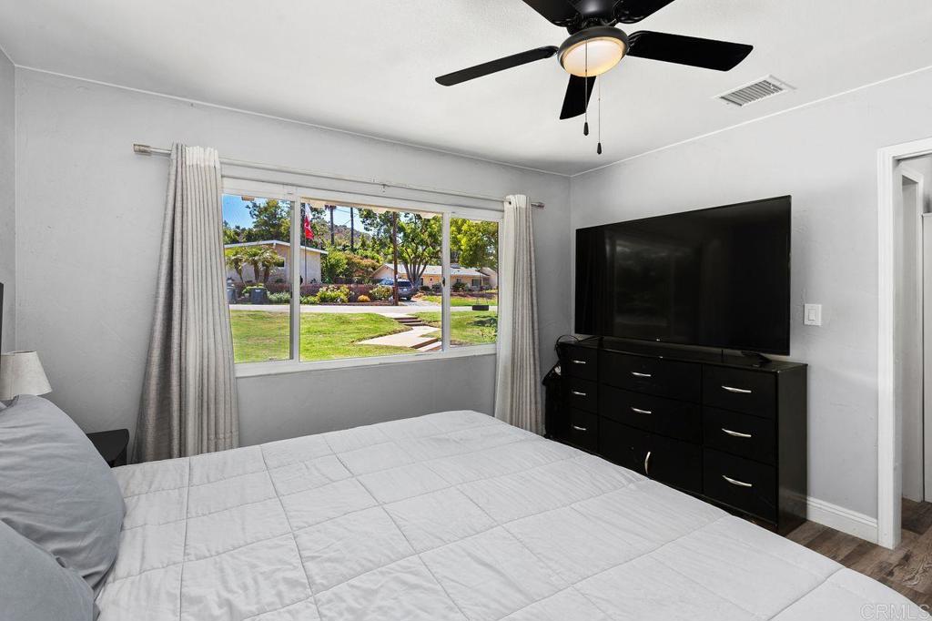 8229 Medill Avenue El Cajon, CA 92021 - Photo 16 of 34 a bedroom with a bed and a flat screen tv