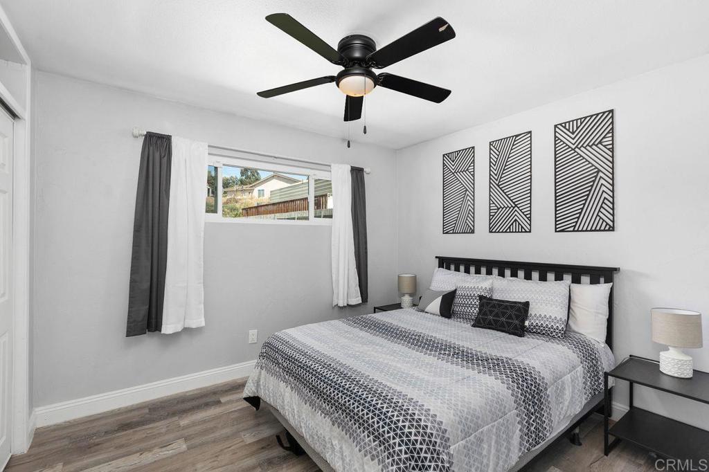 8229 Medill Avenue El Cajon, CA 92021 - Photo 20 of 34 a bedroom with a bed and a painting on the wall