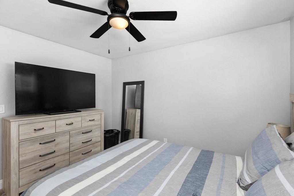 8229 Medill Avenue El Cajon, CA 92021 - Photo 22 of 34 a bedroom with a bed and a flat screen tv