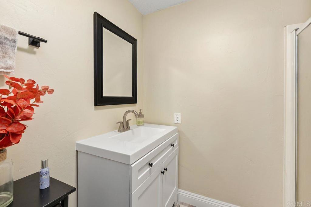 8229 Medill Avenue El Cajon, CA 92021 - Photo 26 of 34 a bathroom with a sink and a mirror