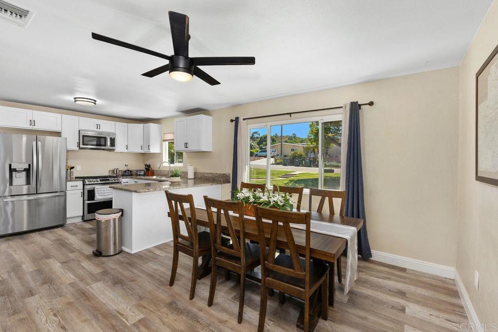 8229 Medill Avenue El Cajon, CA 92021 - Photo 6 of 34 a view of a dining room with furniture window and wooden floor