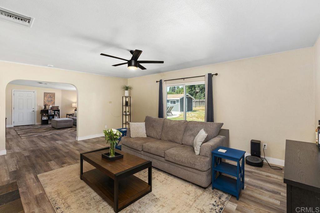 8229 Medill Avenue El Cajon, CA 92021 - Photo 9 of 34 a living room with furniture a window and a chandelier