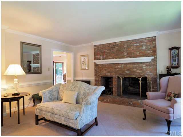 6208 Dresden Lane Raleigh, NC 27612 - Photo 11 of 25 a living room with furniture and a fireplace