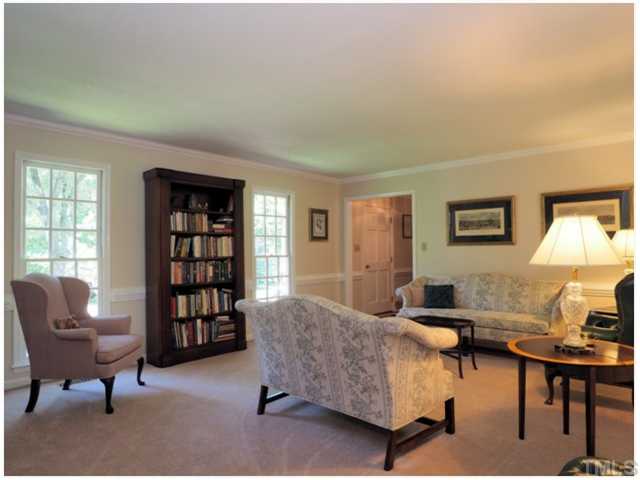 6208 Dresden Lane Raleigh, NC 27612 - Photo 12 of 25 a living room with furniture and a window
