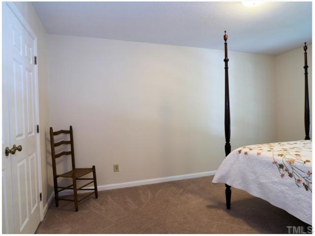 6208 Dresden Lane Raleigh, NC 27612 - Photo 16 of 25 a bedroom with a bed and a window