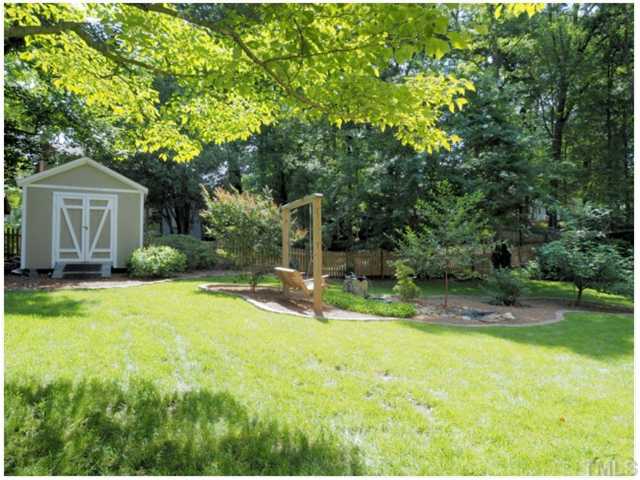 6208 Dresden Lane Raleigh, NC 27612 - Photo 24 of 25 a view of house with backyard and trees