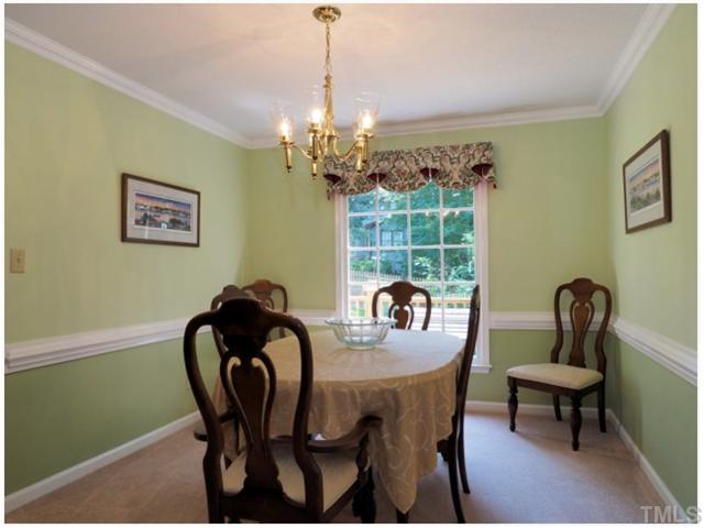 6208 Dresden Lane Raleigh, NC 27612 - Photo 8 of 25 a view of a dining room with furniture window and outside view