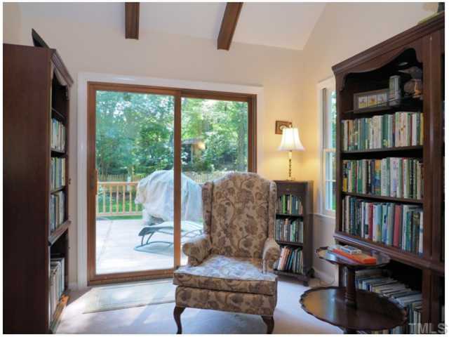 6208 Dresden Lane Raleigh, NC 27612 - Photo 10 of 25 a living room with furniture and a book shelf