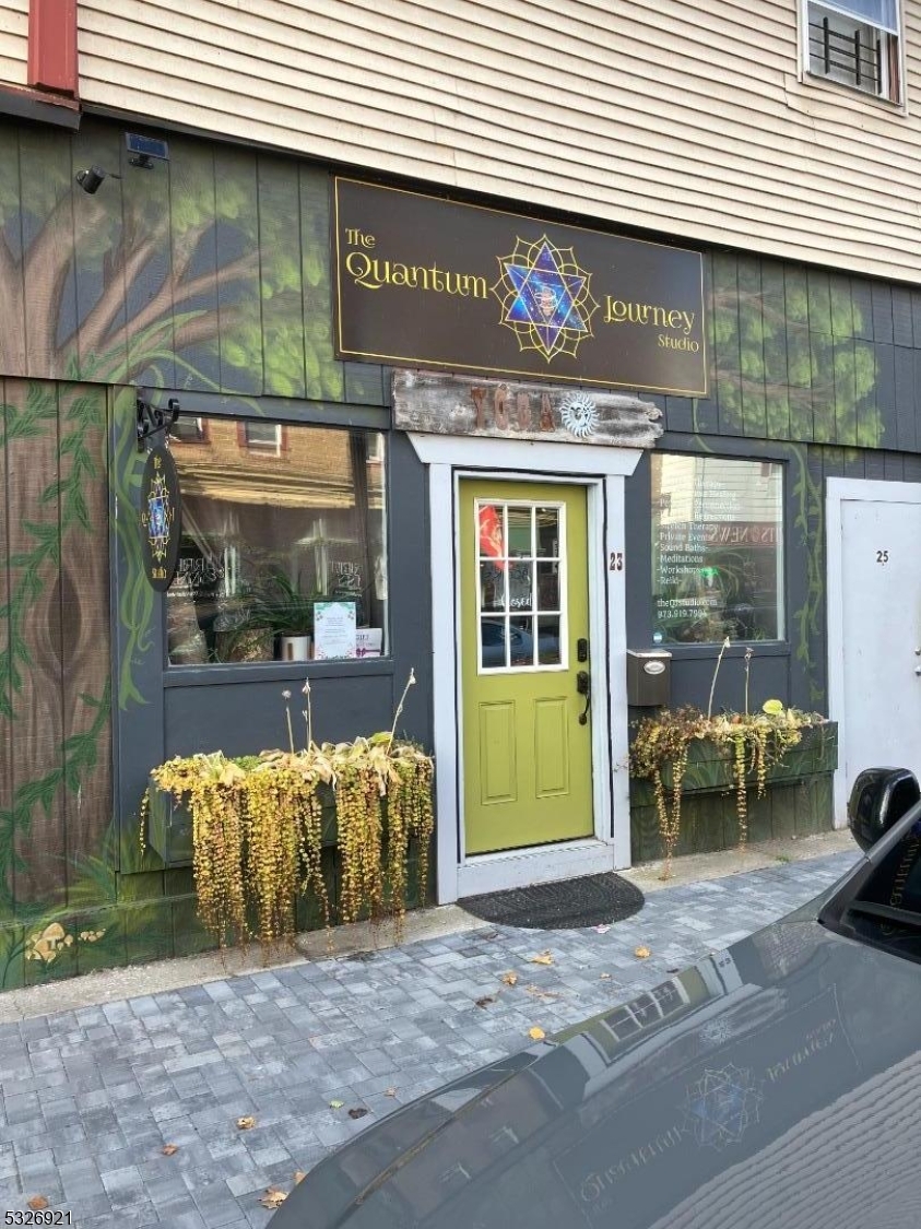 a view of a chair and table in backyard of the house