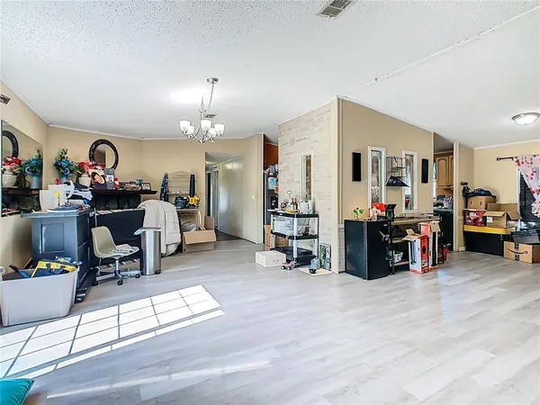 a view of a livingroom with workspace and a window