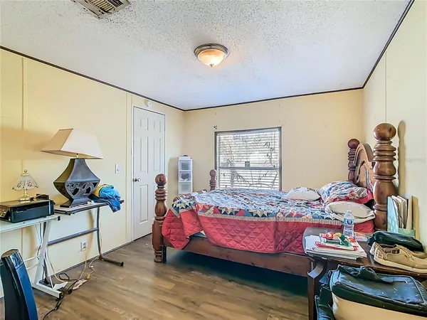 a bedroom with bed and a window