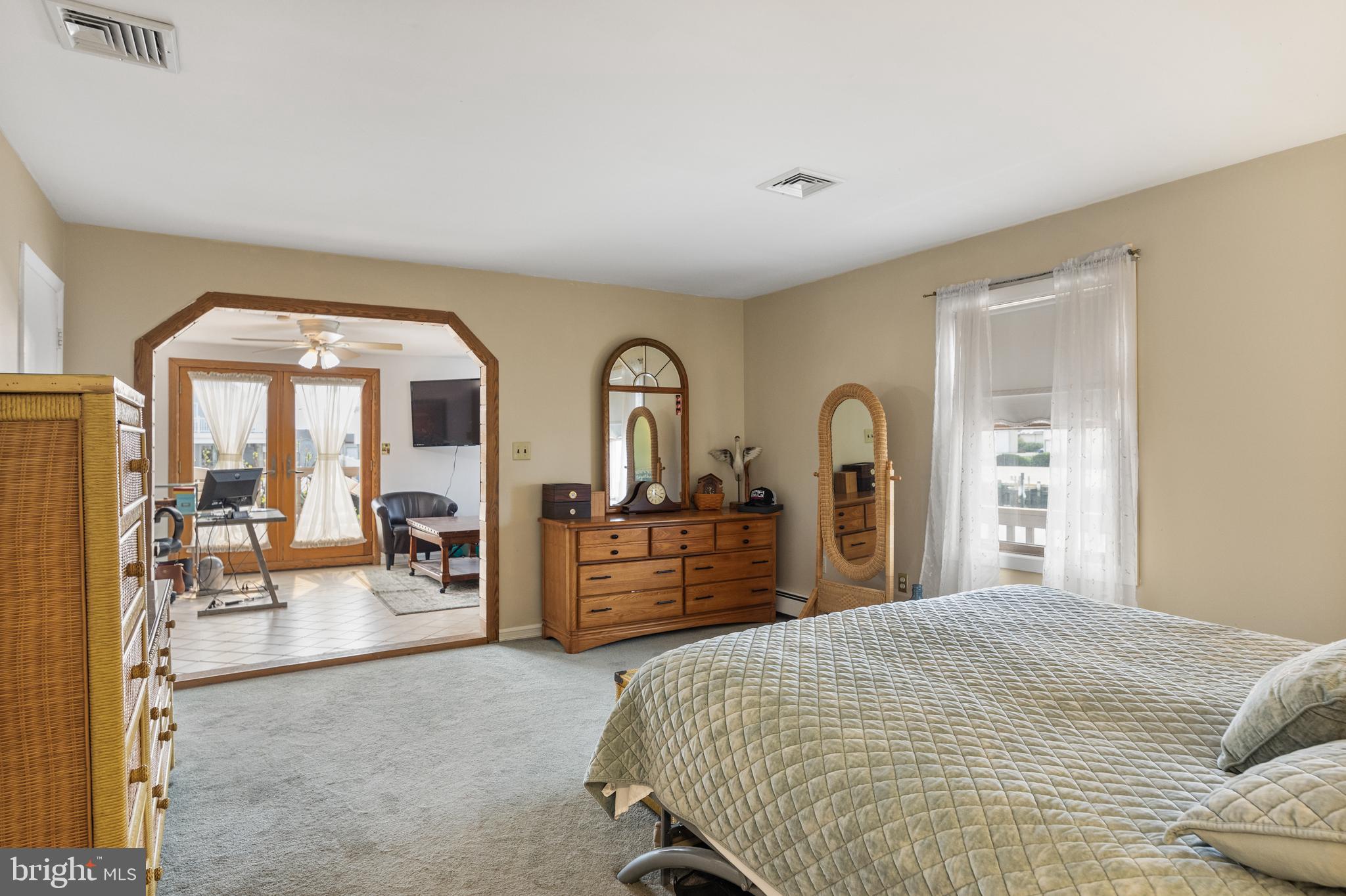 8 South Captain Drive Tuckerton, NJ 08087 - Photo 16 of 52 a bedroom with a large bed and ceiling fan