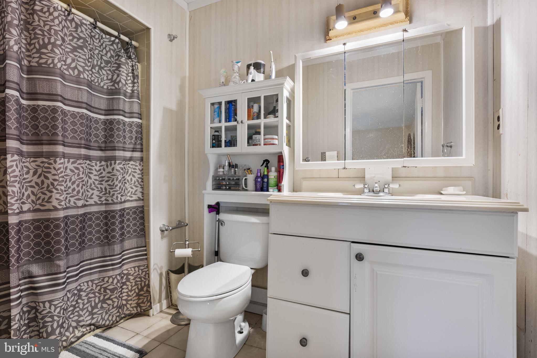 8 South Captain Drive Tuckerton, NJ 08087 - Photo 18 of 52 a bathroom with a sink toilet and shower