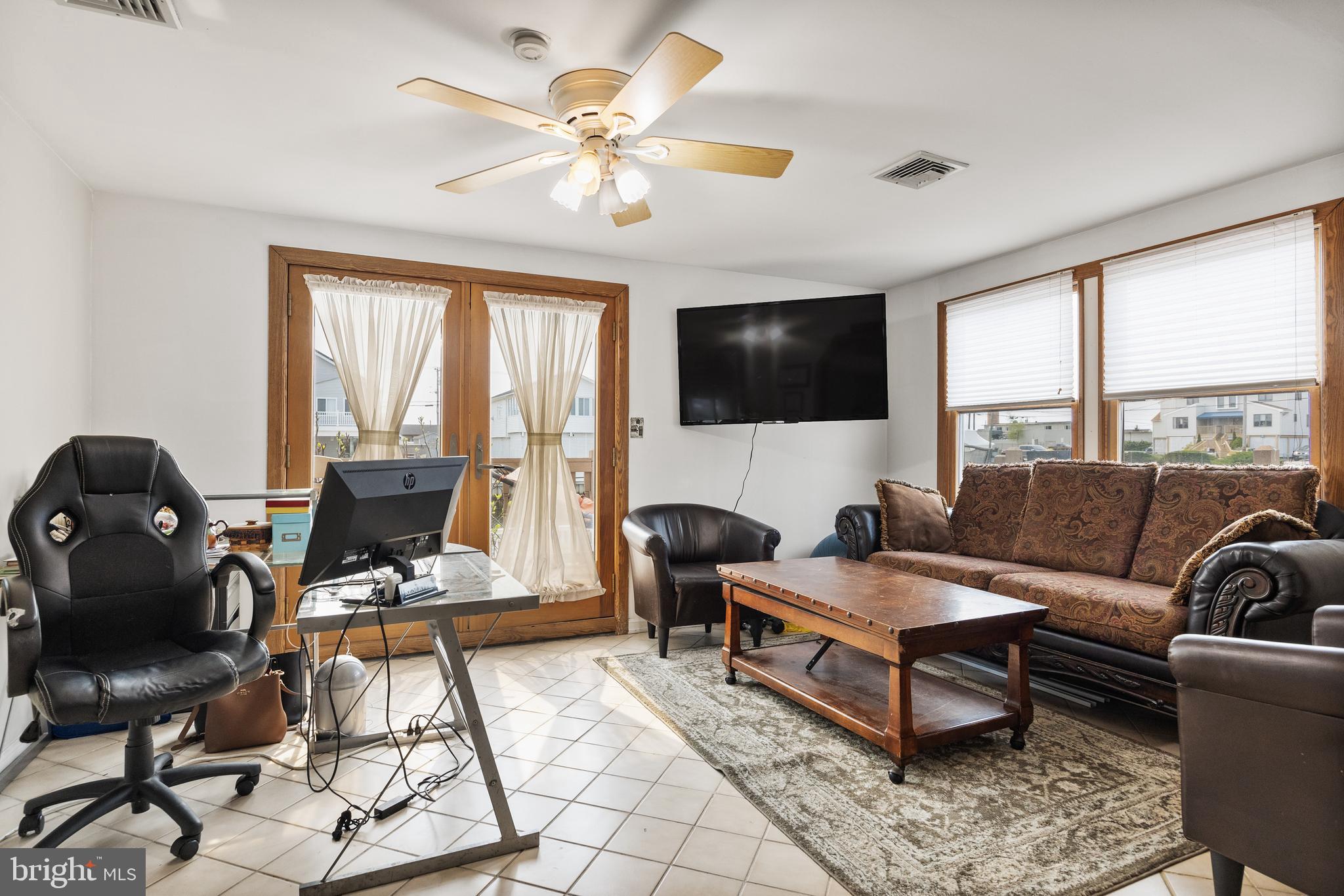 8 South Captain Drive Tuckerton, NJ 08087 - Photo 19 of 52 a living room with furniture and a flat screen tv