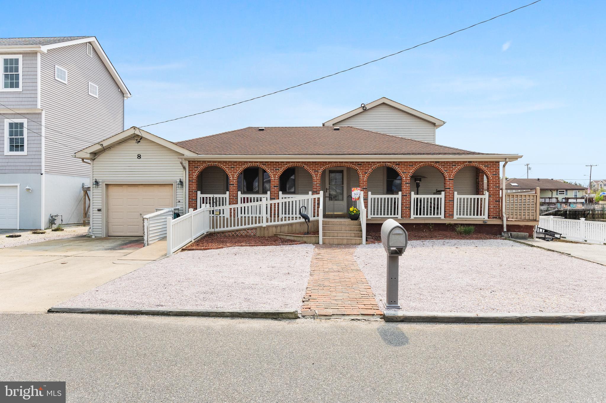 8 South Captain Drive Tuckerton, NJ 08087 - Photo 2 of 52 a front view of a house with garage