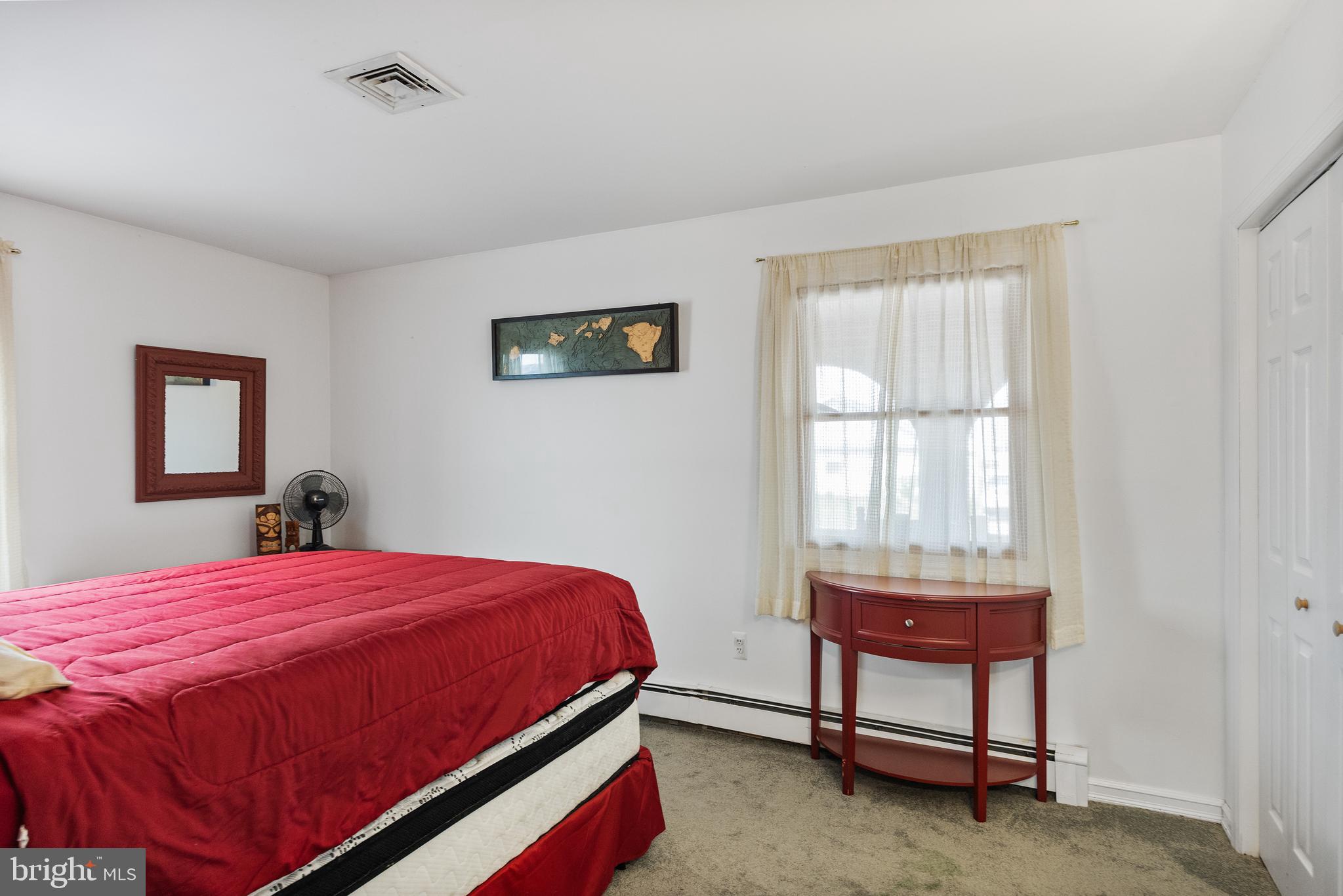 8 South Captain Drive Tuckerton, NJ 08087 - Photo 22 of 52 a bedroom with a bed and a table