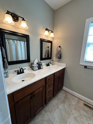 a view of a bathroom with tub and sink