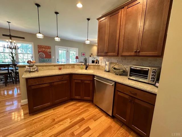 a kitchen with a sink stove and wooden cabinets