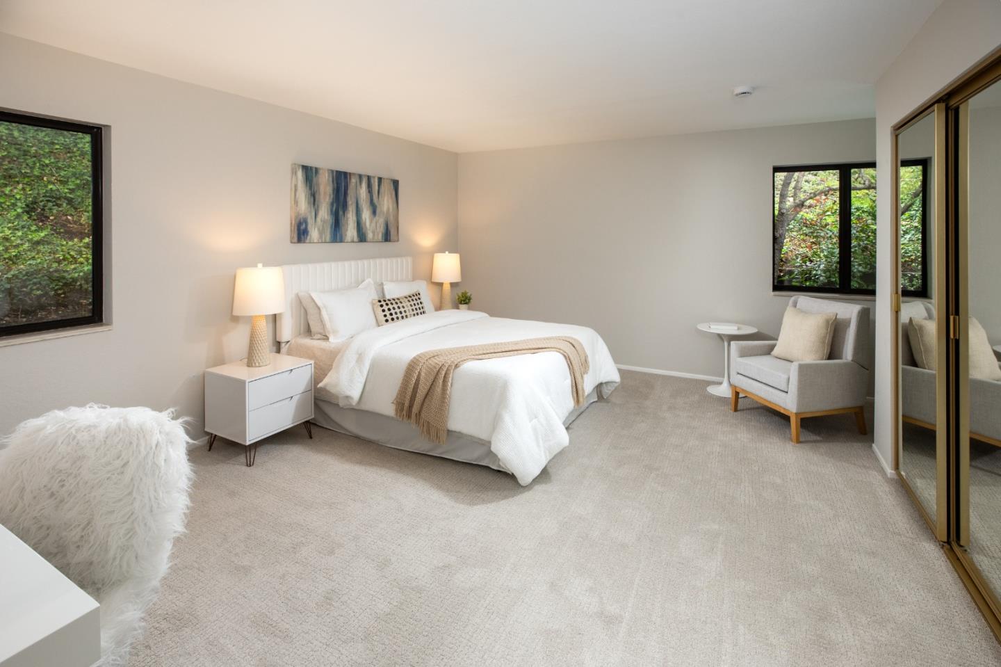 22415 Rancho Deep Cliff Drive Cupertino, CA 95014 - Photo 17 of 33 a bedroom with bed and a large window