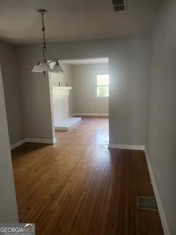 a kitchen with a cabinets and white appliances