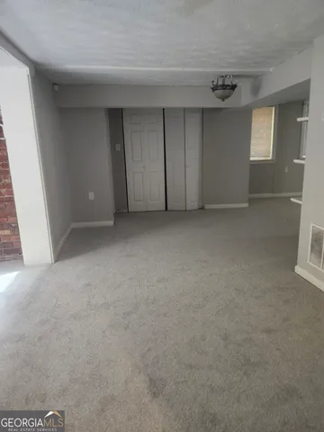 a view of empty room with windows