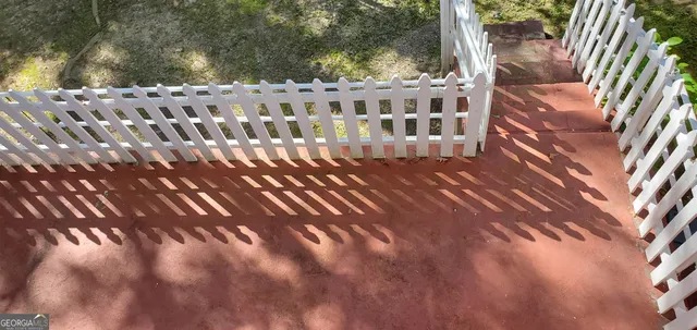a view of balcony with wooden floor
