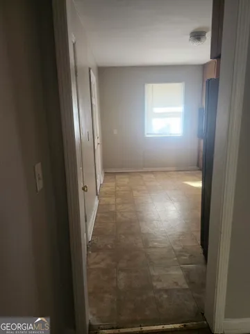a kitchen with a refrigerator and a sink
