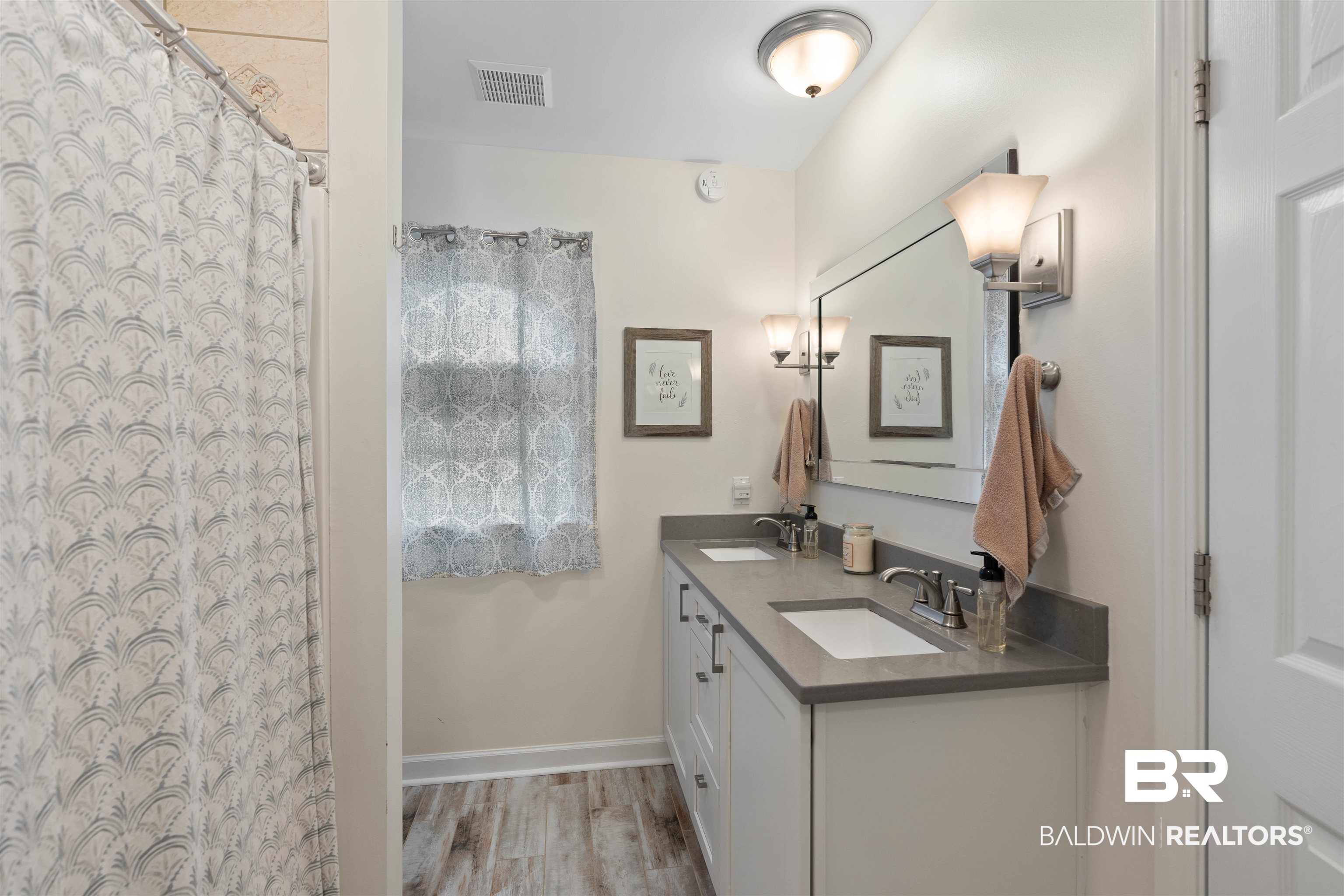 14631 Rdg Road East Summerdale, AL 36580 - Photo 24 of 46 Bathroom with vanity, wood-type flooring, and a shower with curtain