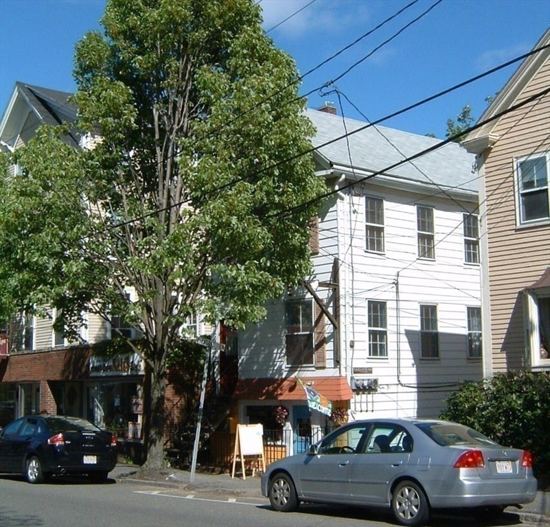 128 Pleasant Street, Unit 2 Marblehead, MA 01945 - Photo 11 of 13 a view of a cars parked on the side of a street